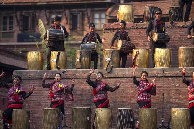 Artists perform during the traditional Newari community music festival in Bhaktapur, Nepal, Monday, April 8, 2024. The festival was organized by the Shree Nasa Heima Baja Khala group with the aim to highlight the rich heritage of local Newari traditional dance and music. (Photo by Niranjan Shrestha/AP Photo)