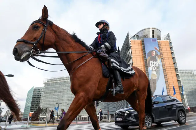 Mounted police officers patrol near the EU institutions buildings ahead of a potential protest against coronavirus disease (COVID-19) restrictions called “Convoi Europeen de la Liberte 2022” (“European Freedom Convoy 2022”), in Brussels, Belgium on February 14, 2022. (Photo by Yves Herman/Reuters)