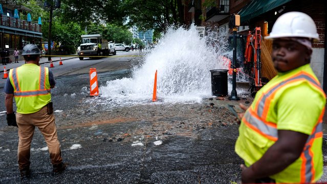 Workers respond to a broken water line in Atlanta on Saturday, June 1, 2024. A string of water main breaks left parts of the city without drinkable water for nearly a week. (Photo by Mike Stewart/AP Photo)