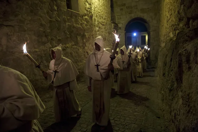 Penitents from the Cristo de la Buena Muerte (Good Dead Christ) brotherhood take part in a procession in the early hours of the morning on April 11, 2017 in Zamora, Spain. Spain celebrates holy week before Easter with processions in most Spanish towns and villages. (Photo by Pablo Blazquez Dominguez/Getty Images)
