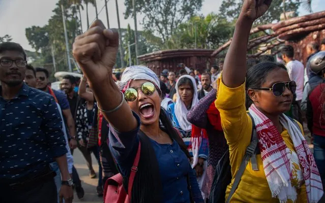 Indians shout slogans as they protest against a new citizenship law in Gauhati, India, Monday, December 16, 2019. The new law gives citizenship to non-Muslims who entered India illegally to flee religious persecution in several neighboring countries. (Photo by Anupam Nath/AP Photo)