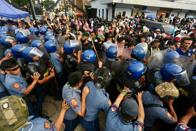 Anti-riot police block supporters of religious leader Apollo Quiboloy as they stage a protest rally outside the Kingdom of Jesus Christ (KOJC) compound in Davao city, Davao del Sur province, about 1,500 kilometers south of Manila, Philippines, 26 August 2024. The Philippine National Police (PNP) are searching the 30-hectare Kingdom of Jesus Christ (KOJC) compound to arrest KOJC leader Pastor Apollo Quiboloy, who claims he is the “Son of God”. Quiboloy and five other KOJC members are facing charges of child abuse and human trafficking. (Photo by Cerilo Ebrano/EPA/EFE)