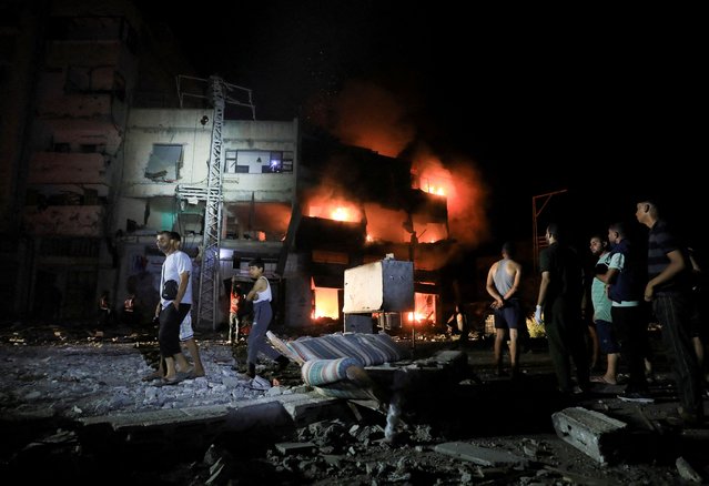 Palestinians gather at the site of an Israeli strike at a house in Gaza City on August 29, 2024. (Photo by Dawoud Abu Alkas/Reuters)