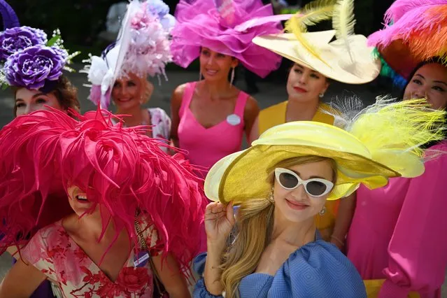 Visitors wear fancy hats as they attend Ladies Day at Royal Ascot, in Ascot, Berkshire, Britain, 16 June 2022. Royal Ascot is Britain's most valuable horse race meeting and social event running daily from 14 to 18 June 2022. Britain's Queen Elizabeth is not expected to attend due to on-going mobility issues. (Photo by Andy Rain/EPA/EFE)
