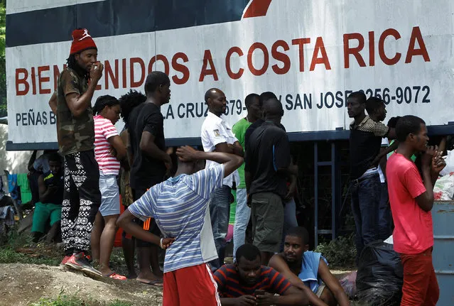 African migrants stranded in Costa Rica stand outside of a makeshift camp at the border between Costa Rica and Nicaragua, in Penas Blancas, Costa Rica, July 14, 2016. (Photo by Juan Carlos Ulate/Reuters)