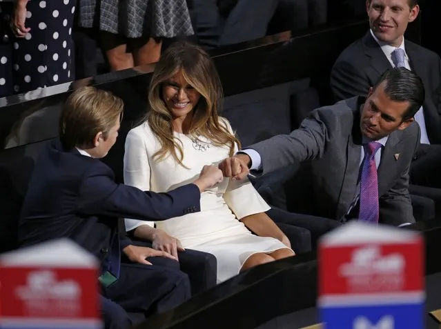 Barron Trump (L) bumps a fist with Donald Trump Jr. as Melania Trump watches at the Republican National Convention in Cleveland, Ohio, U.S., July 21 2016. (Photo by Carlo Allegri/Reuters)