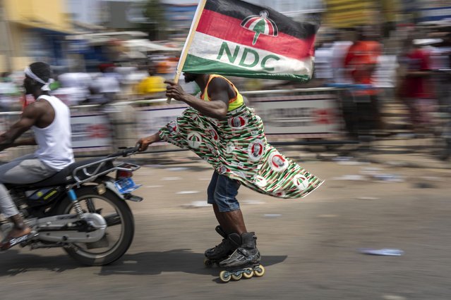 Supporters of opposition candidate and former President John Dramani Mahama celebrate his electoral victory after his opponent conceded, in Accra, Ghana, December 8, 2024. (Photo by Jerome Delay/AP Photo)