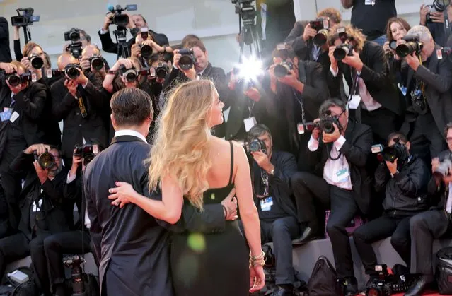 Actor Johnny Depp and his wife Amber Heard pose for photographers during the red carpet event for the movie “Black Mass” at the 72nd Venice Film Festival in northern Italy September 4, 2015. (Photo by Manuel Silvestri/Reuters)