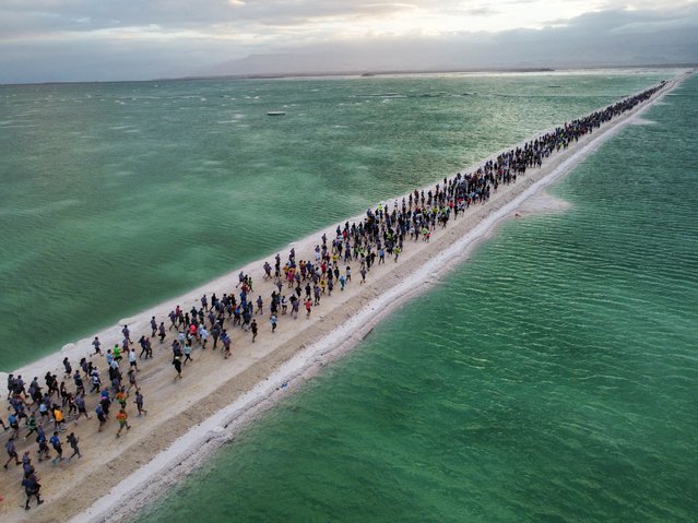 Runners in action at the starting point of the 6th Dead Sea Marathon in Ein Bokek, the Dead Sea near the border between Israel and Jordan, Israel, 07 February 2025. According to organisers around 8,000 runners took part in the 6th Dead Sea Marathon. (Photo by Abir Sultan/EPA)