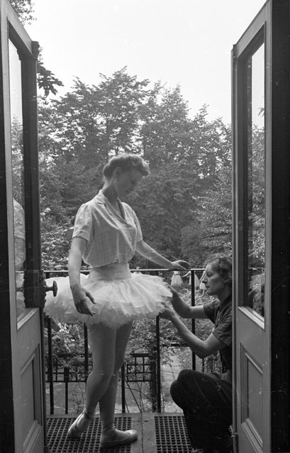 A dancer with The Ballet Guild, founded by Christmas Humphreys and based in St. John's Wood, London, has her tutu adjusted by the wardrobe mistress. 28th August 1943. (Photo by Felix Man/Picture Post)