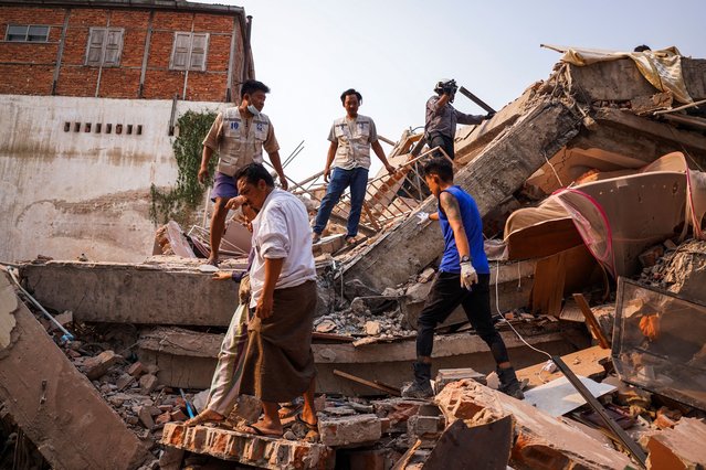 Rescuers work at the site of a building that collapsed, in the aftermath of a strong earthquake, in Mandalay, Myanmar, on March 30, 2025. (Photo by Reuters/Stringer)