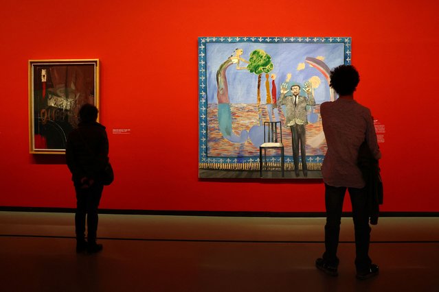 Visitors look at the paintings “Going to be a Queen for Tonight, 1960” and "Play Within a Play, 1963" by British painter David Hockney during a press visit ahead of the opening of the exhibition “David Hockney 25” at the Fondation Louis Vuitton in Paris, France, on April 8, 2025. (Photo by Gonzalo Fuentes/Reuters)