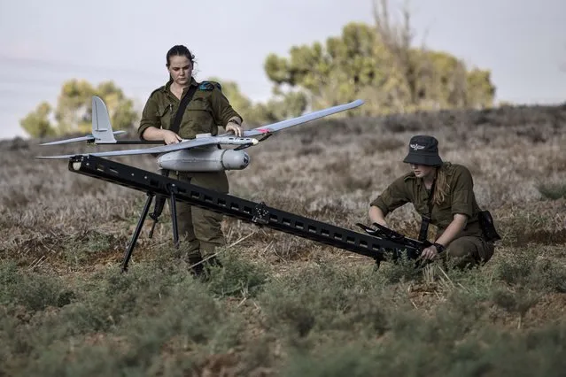 Israeli soldiers prepare to launch a drone near the border with Gaza Strip, Friday, August 21, 2020. The Israeli military says Palestinian militants fired 12 rockets at Israel from the Gaza Strip overnight, nine of which were intercepted. (Photo by Tsafrir Abayov/AP Photo)
