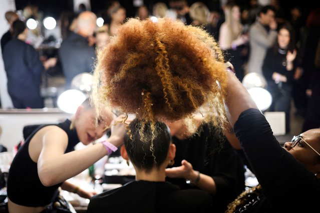 A model prepares backstage at The Blonds Fall/Winter 2024 collection show during New York Fashion Week, in New York City on February 11, 2024. (Photo by Andrew Kelly/Reuters)