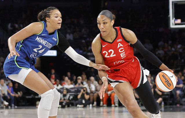 Las Vegas Aces center A'ja Wilson (22) drives against Minnesota Lynx forward Napheesa Collier (24) during the first half of a WNBA basketball game Saturday, August 2, 2025, in Las Vegas. (Photo by Steve Marcus/Las Vegas Sun via AP Photo)