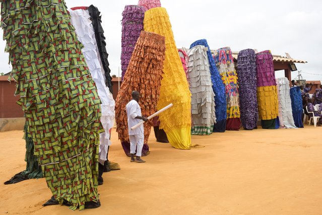 Gounouko masks from the south of Benin, specifically the Porto-Novo region, are showcased during a performance in the second edition of the Benin Mask Festival, in Porto-Novo, Benin, on August 3, 2025. (Photo by Charles Placide Tossou/Reuters)