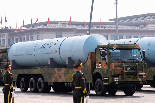 Members of the People's Liberation Army stand as the strategic strike group displays JL-3 intercontinental-range submarine-launched ballistic missiles, during a military parade to mark the 80th anniversary of the end of World War Two, in Beijing, China, on September 3, 2025. (Photo by Tingshu Wang/Reuters)