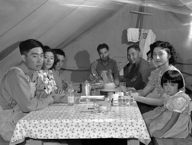 The Ouchida family pictured at the Nyssa, Oregon, farm labor camp, between 1942 and 1944. The children were all born in the US, and one son was serving in the army. (Photo by Russell Lee/Japanese American National Museum)