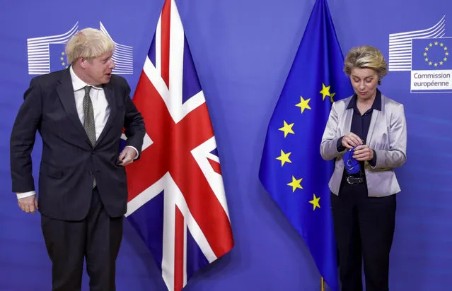 European Commission President Ursula von der Leyen, right, welcomes British Prime Minister Boris Johnson prior to a meeting at EU headquarters in Brussels, Wednesday, December 9, 2020. Leaders of Britain and the EU meet Wednesday for a dinner that could pave the way to a post-Brexit trade deal, or tip the two sides toward a chaotic economic rupture at the end of the month. (Photo by Olivier Hoslet, Pool via AP Photo)