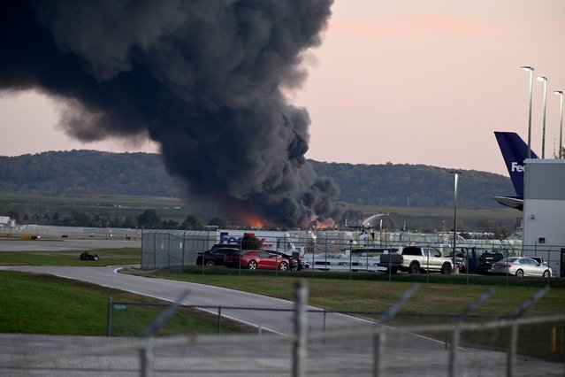 Fire and smoke mark where a UPS cargo plane crashed near Louisville Muhammad Ali International Airport on November 04, 2025 in Louisville, Kentucky. The fully fueled plane crashed shortly after takeoff with a shelter-in-place order issued for within 5 miles of the airport. (Photo by Stephen Cohen/Getty Images)