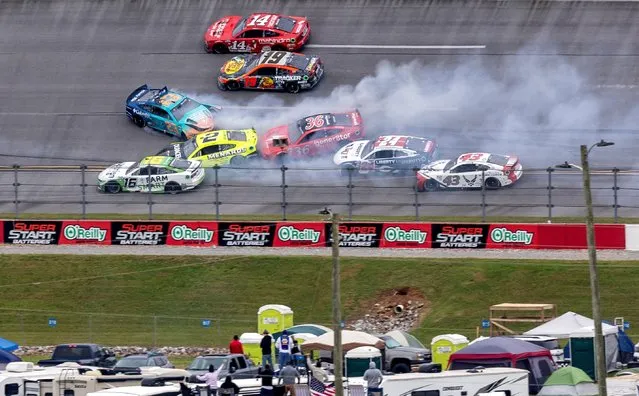 A multi-car wreck continues from contact between NASCAR Cup Series drivers Bubba Wallace (23) and Ryan Blaney (12) on the final lap at Talladega Superspeedway in Talladega, Alabama on April 23, 2023. (Photo by Vasha Hunt/USA TODAY Sports)