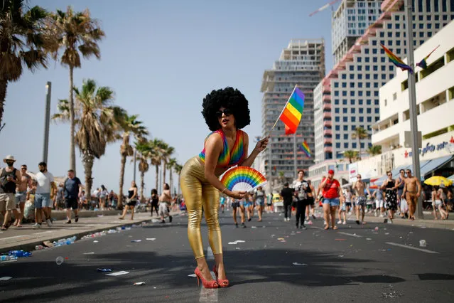 Revellers take part in a gay pride parade in Tel Aviv, Israel on June 8, 2018. (Photo by Corinna Kern/Reuters)