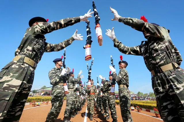 India's Central Armed Police Forces, Sashastra Seema Bal (SSB) personnel take part in a passing out parade at their training headquarters near Bhopal, India, 15 December 2015. Around 400 cadets from seventeen states of the country took part in the convocational parade after completing a rigorous training program. (Photo by Sanjeev Gupta/EPA)