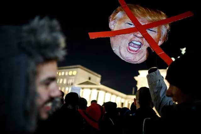 Protesters critical of the recent election of Donald Trump as US President gather for a demonstration near the Brandenburg Gate on November 12, 2016 in Berlin, Germany. A vast majority of people across Europe have reacted to the US Presidential election outcome with dismay. Many have voiced concern that a Trump presidency will usher in a very uncertain future for trans-Atlantic relations, global political stability and effective common measures to combat global warming. (Photo by Carsten Koall/Getty Images)