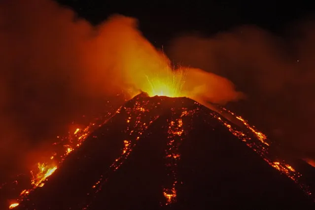 An eruption from Mount Etna lights up the sky during the night, seen from the small village of Fornazzo, under the volcano, Italy, January 18, 2021. (Photo by Antonio Parrinello/Reuters)