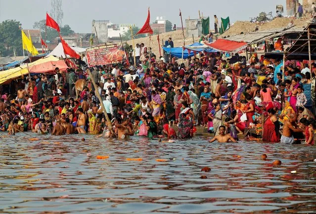 Hindu devotees gather to take a holy dip in the river Ganga on the occasion of the annual Hindu festival of “Karthik Purnima” or full moon night, in Allahabad, India, November 14, 2016. (Photo by Jitendra Prakash/Reuters)
