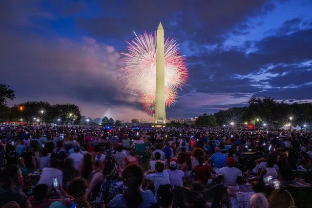 Thousands of spectators watch the annual fireworks display on the National Mall in Washington, DC on Independence Day, July 04, 2023. (Photo by Craig Hudson for The Washington Post)