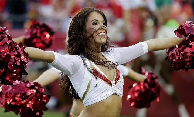 Kansas City Chiefs cheerleaders perform during a preseason game against the San Francisco 49ers in Kansas City. (Photo by Charlie Riedel/Associated Press)