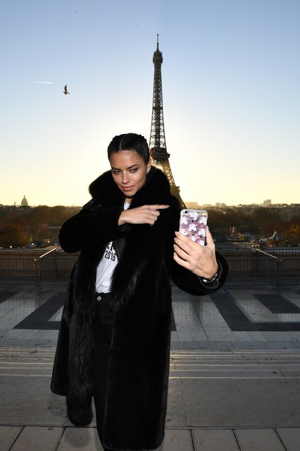 Adriana Lima takes a selfie in front of the Eiffel Tower prior the 2016 Victoria's Secret Fashion Show on November 29, 2016 in Paris, France. (Photo by Dimitrios Kambouris/Getty Images for Victoria's Secret)