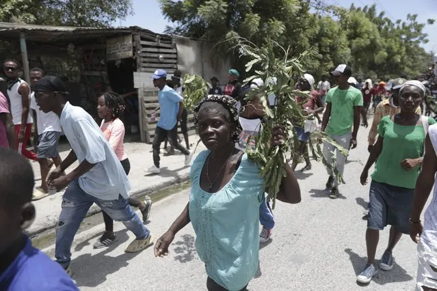 People march to demand the freedom of New Hampshire nurse Alix Dorsainvil and her daughter, who have been reported kidnapped, in the Cite Soleil neighborhood of Port-au-Prince, Haiti, Monday, July 31, 2023. Dorsainvil works for the El Roi Haiti nonprofit organization and the U.S. State Department issued a "do not travel advisory" ordering nonemergency personnel to leave the Caribbean nation amid growing security concerns. (Photo by Joseph Odelyn/AP Photo)