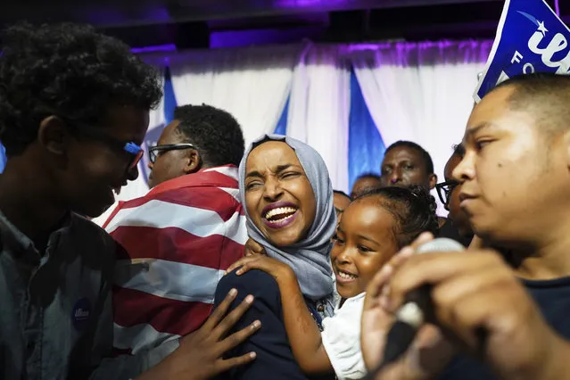 Minnesota Rep. Ilhan Omar, center, celebrates with her children after her Congressional 5th District primary victory, Tuesday, August 14, 2018, in Minneapolis. (Photo by Mark Vancleave/Star Tribune via AP Photo)