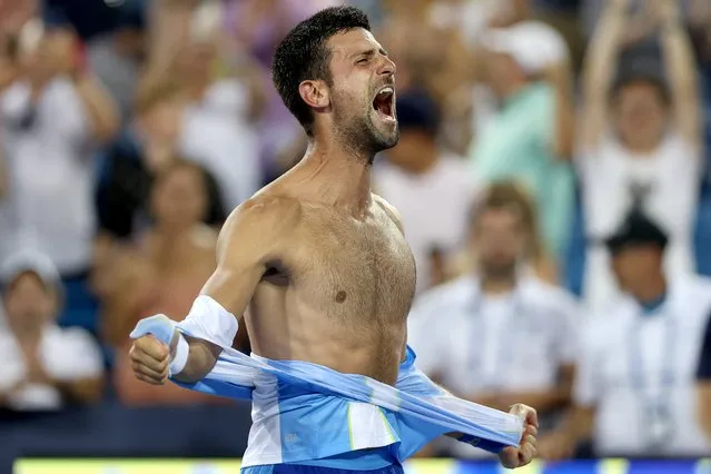 Novak Djokovic of Serbia tears his shirt off after defeating Carlos Alcaraz of Spain during the final of the Western & Southern Open at Lindner Family Tennis Center on August 20, 2023 in Mason, Ohio. (Photo by Matthew Stockman/Getty Images)
