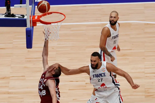 Latvia's Andrejs Grazulis in action with France's Rudy Gobert at the FIBA World Cup in Jakarta, Indonesia on August 27, 2023. (Photo by Willy Kurniawan/Reuters)