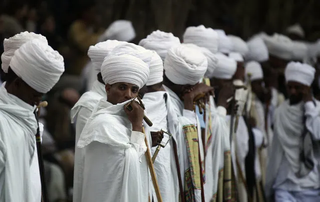 Choir members wait to perfom during Ethiopia's Timket celebration in which the waters are blessed by the priest of Ethiopian Orthodox Tewahedo Church during the second day of Timket in Gondar, Ethiopia, January 20, 2016. (Photo by Tiksa Negeri/Reuters)