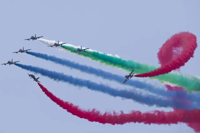 UAE Air Force aerobatic display team perform at Langkawi International Maritime and Aerospace Exhibition in Langkawi, Malaysia, on Wednesday, March 18, 2015. (Photo by Vincent Thian/AP Photo)