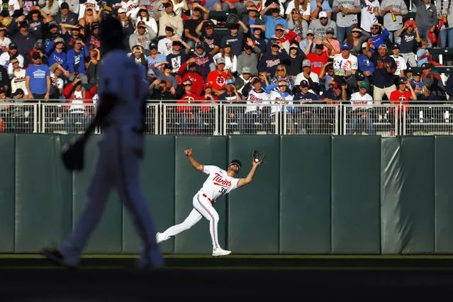 Minnesota Twins left fielder Matt Wallner catches the fly out hit by Houston Astros' Mauricio Dubon in the fifth inning of Game 3 of an American League Division Series baseball game, Tuesday, October 10, 2023, in Minneapolis. (Photo by Bruce Kluckhorn/AP Photo)