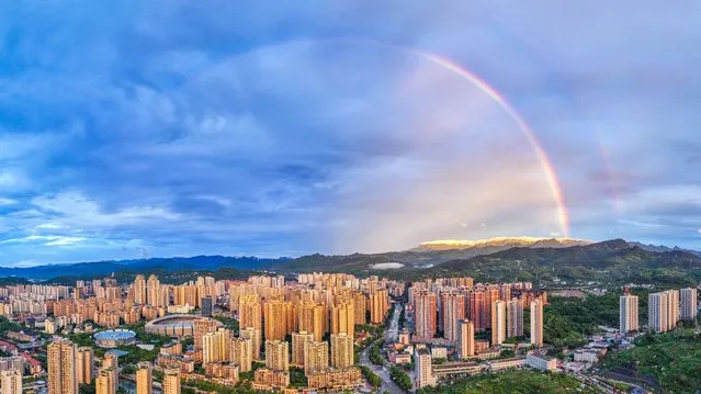 A double rainbow appear over Jinfo Mountain in Chongqing, China, on the evening of August 2, 2023. (Photo by Costfoto/NurPhoto/Rex Features/Shutterstock)