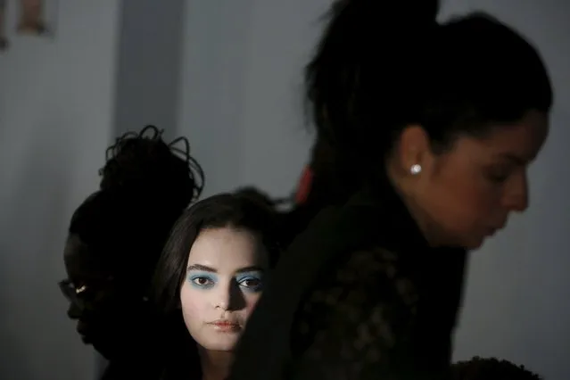 A model waits to be prepared backstage before the Thom Browne Fall/Winter 2016 collection presentation during New York Fashion Week February 15, 2016. (Photo by Andrew Kelly/Reuters)