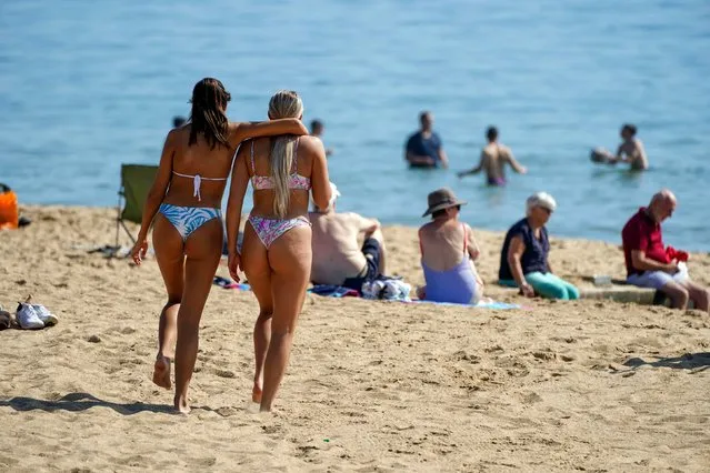 People enjoy the warm weather on Bournemouth Beach in Dorset, United Kingdom on Monday, September 6, 2021. (Photo by Steve Parsons/PA Images via Getty Images)
