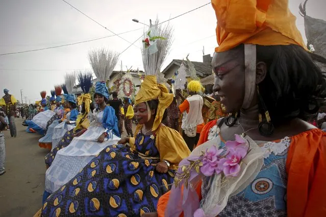 People take part in a parade during the Popo (Mask) Carnival of Bonoua, in the east of Abidjan, April 18, 2015. (Photo by Luc Gnago/Reuters)