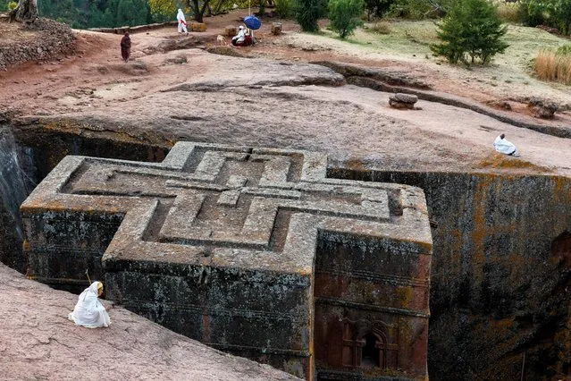 The church of St. George, the most famous in Lalibela, Ethiopia, shaped in a Greek Orthodox cross. It was carved by hand and completed in over 20 years. (Photo by Mario Adario/National Geographic Traveller UK)
