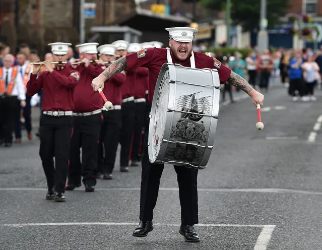 The drummer with the Shankill Protestant Flute band can be seen as the annual Twelfth of July march takes place on July 12, 2021 in Belfast, Northern Ireland. The Twelfth of July marches are a protestant celebration of King William of Oranges victory over the catholic King James at the Battle of the Boyne in 1690. (Photo by Charles McQuillan/Getty Images)