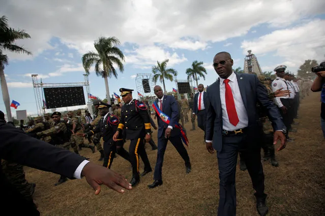 Haitian President Jovenel Moise (C) and National Police Chief Michel-Ange Gedeon look over National Police officers at the inauguration in the National Palace of Port-au-Prince, Haiti February 7, 2017. (Photo by Andres Martinez Casares/Reuters)