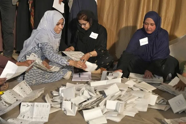 Members of polling staff count the votes after. the polls closed for parliamentary elections, in Karachi, Pakistan, Thursday, February 8, 2024. (Photo by Fareed Khan/AP Photo)