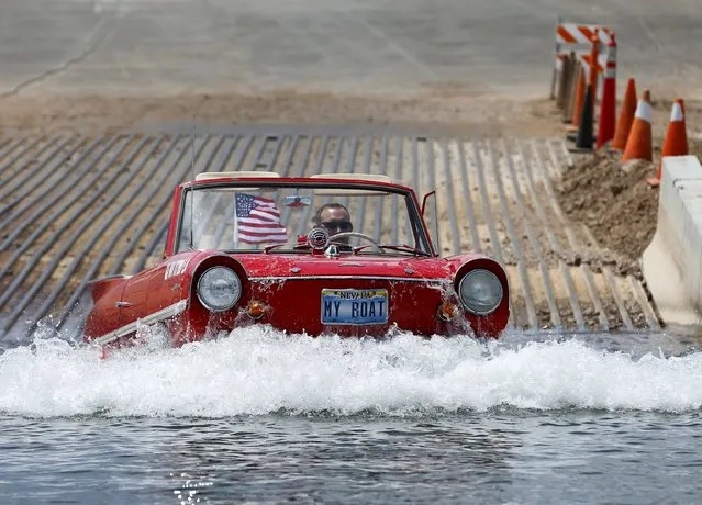 James Spears takes his 1964 German built Amphicar for a drive on Lake Mead in Nevada May 6, 2015. A prolonged drought in the Western United States has drastically affected the level of the lakes water. (Photo by Mike Blake/Reuters)