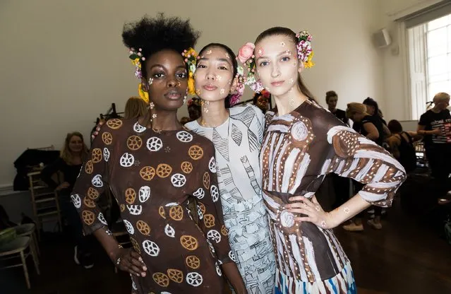 Models backstage ahead of the Tata Naka show during the London Fashion Week February 2017 collections at the ICA on February 21, 2017 in London, England. (Photo by Tim P. Whitby/Getty Images)